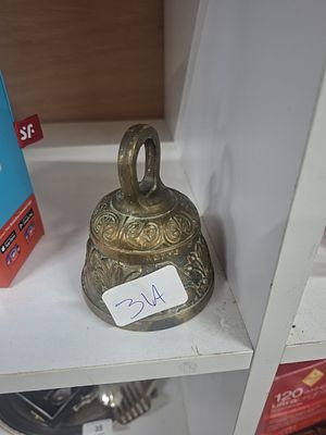 vintage brass bell with pelicans, dog, lion, etc - very heavy for size