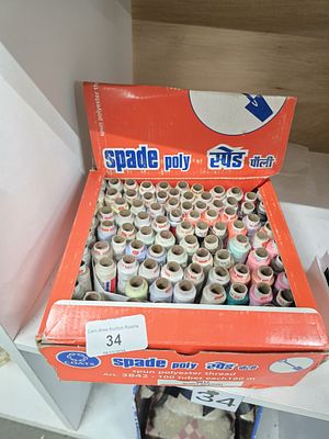 boxed tubes of spun polyester threads