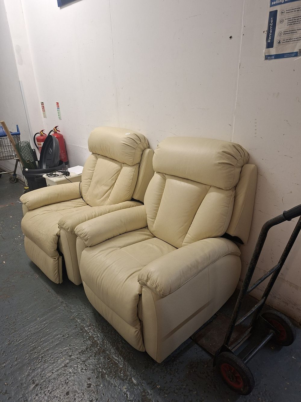 Two leather chairs one electric recliner
