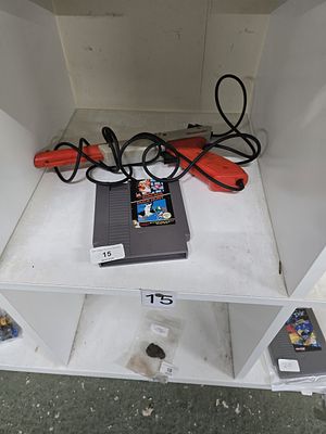 vintage nintendo zapper with nintendo super mario and duck hunt