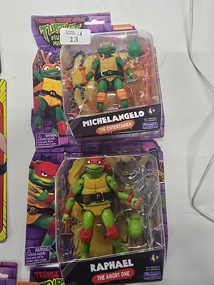 A Pair of Playmates Teenage Mutant Ninja Turtles Mutant Mayhem Action Figures