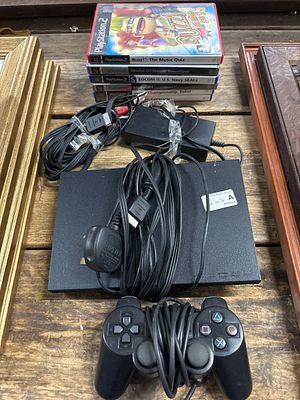 A Sony PlayStation 2 Slim untested Games Console Bundle with Two Controllers and Games