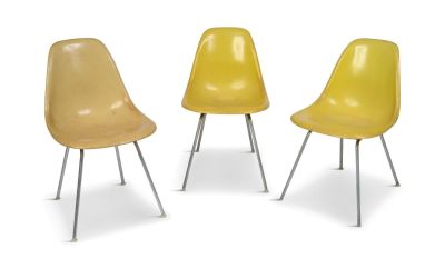Three Herman Miller Chairs. Fiberglass bucket chairs, wear to seats, one with two holes in seat.
