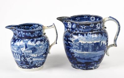 Two Blue Staffordshire Pitchers. Heights 8 and 7 inches, each with repairs and chips.