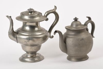 Two Sellew & Co. American Pewter Teapots. Heights 7.5 and 9 inches. Damages and dents to both.