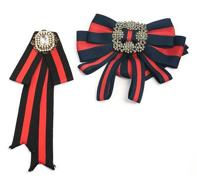 Two Rhinestone Brooches. Lengths 8 and 9 inches, one lacking pin.