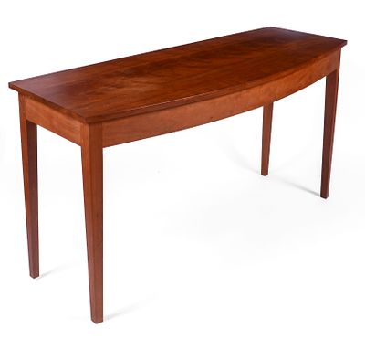 Thomas Moser Cherry Bow Front Glove Table. Height 29 inches, length 54 inches, depth 19 inches.