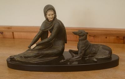 Bronze Sculpture of a Woman and Dog. Height 11 inches, length 20 inches. Missing one hand.