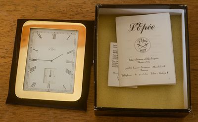 L'Epee French Desk Clock. 4 x 3.25 inches. In original box. Not tested for operation.