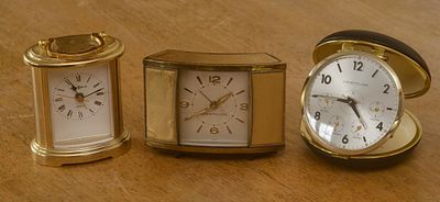Three Desk Clocks. Westclox, diameter 3.5 inches, Westclox, 4 x 2.5 inches, and Howard Miller. 