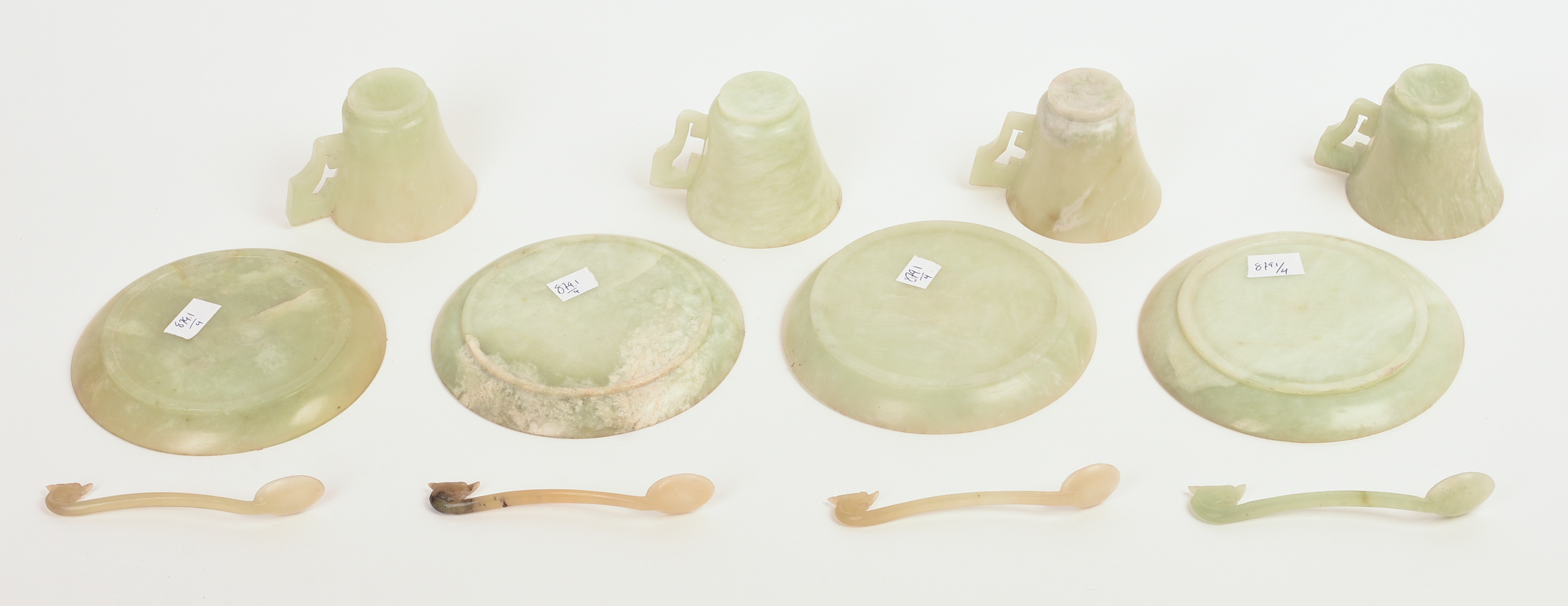 FOUR CHINESE JADE TEA CUPS, SAUCERS, AND SPOONS.