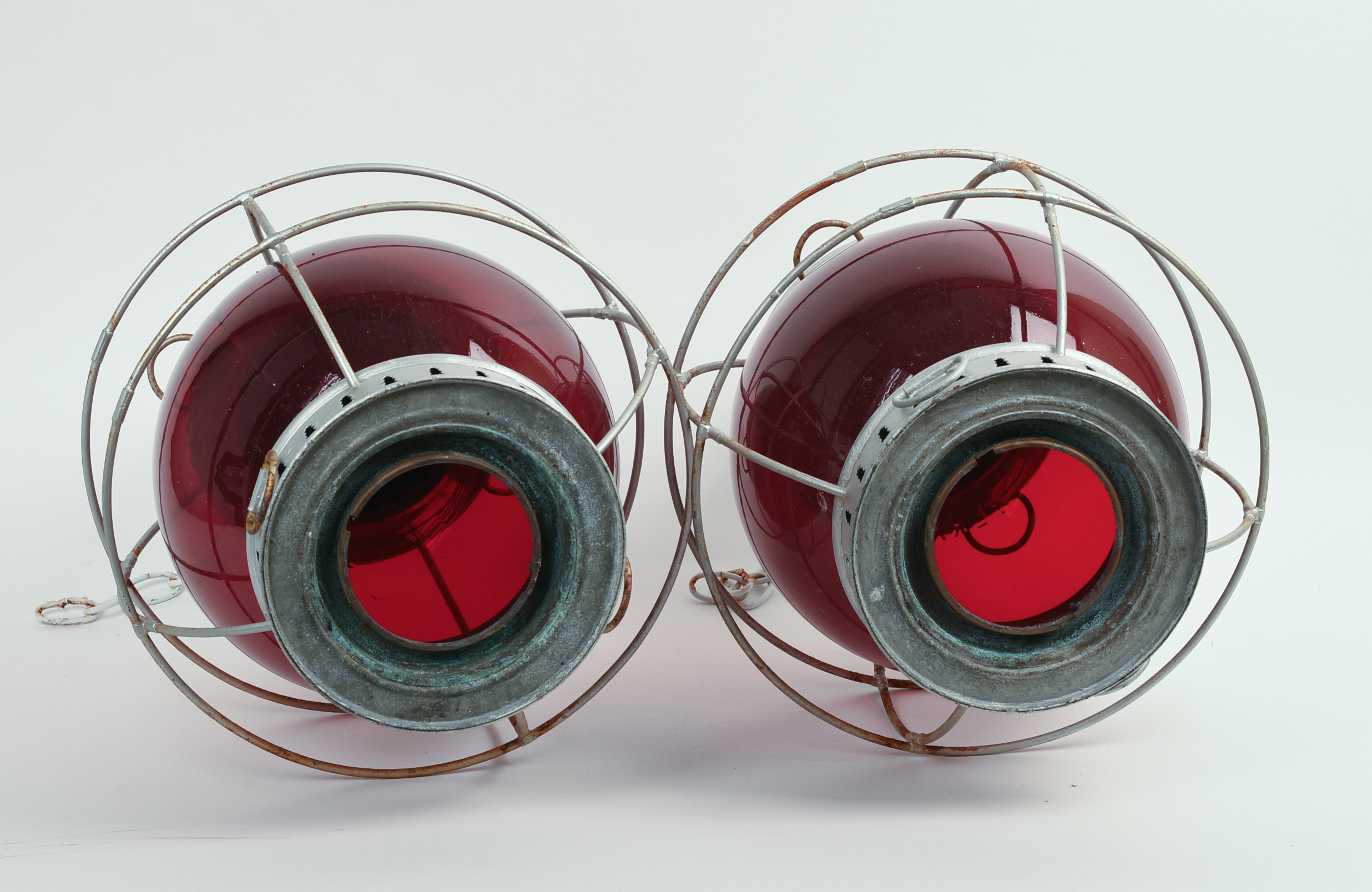 PAIR OF PERKIN'S RED DISTRESS LANTERNS.
