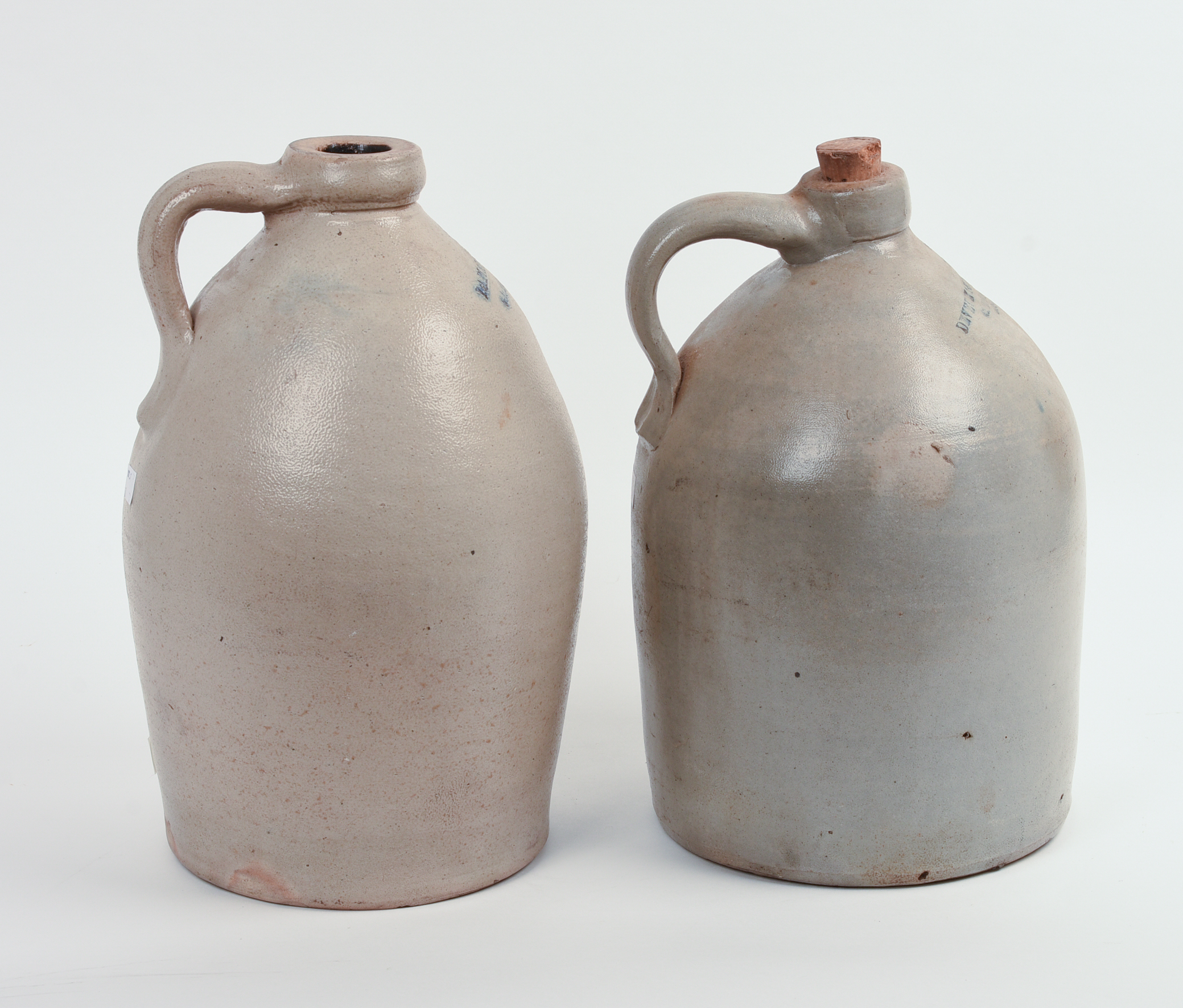 TWO TWO-GALLON STONEWARE JUGS.