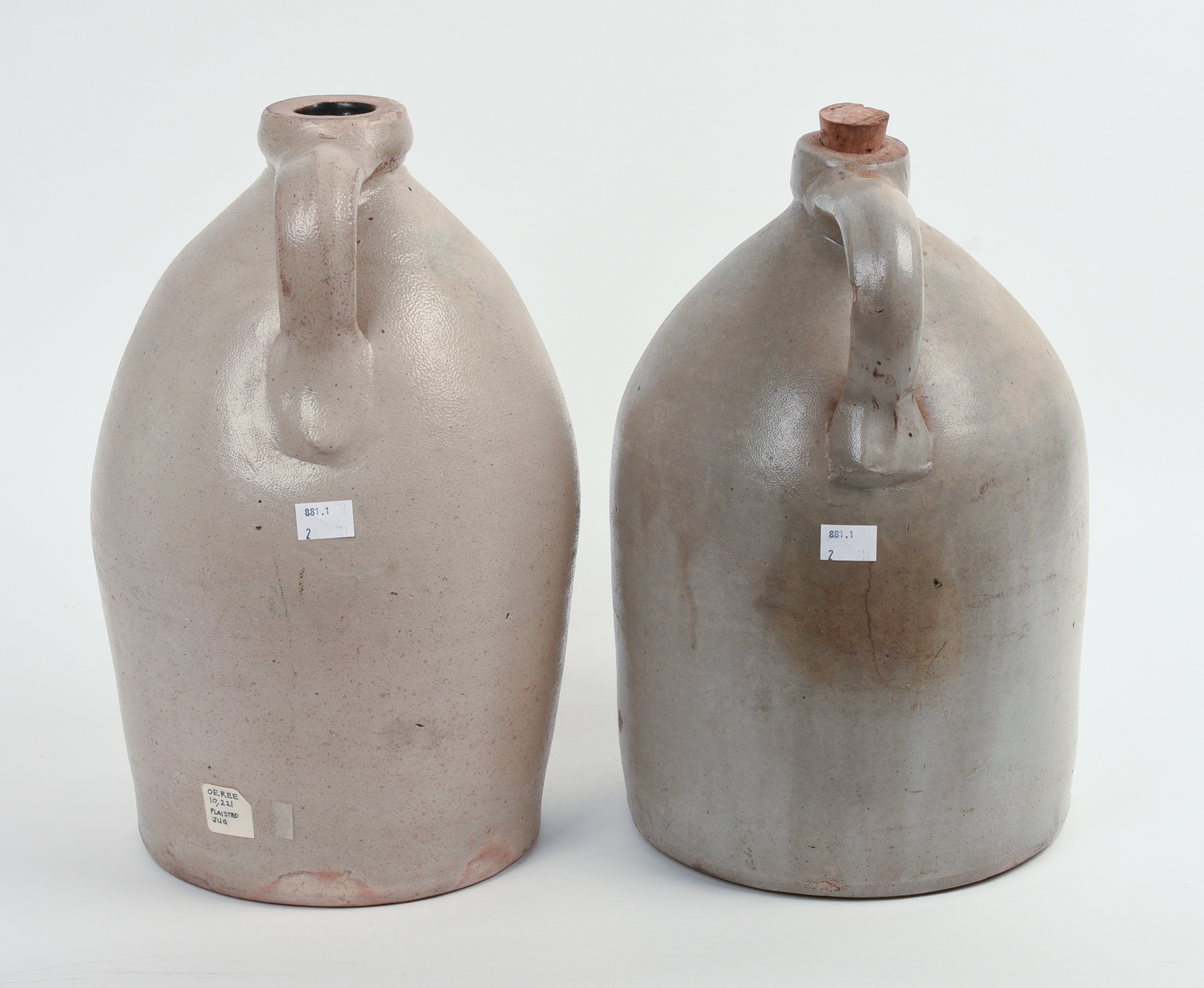 TWO TWO-GALLON STONEWARE JUGS.