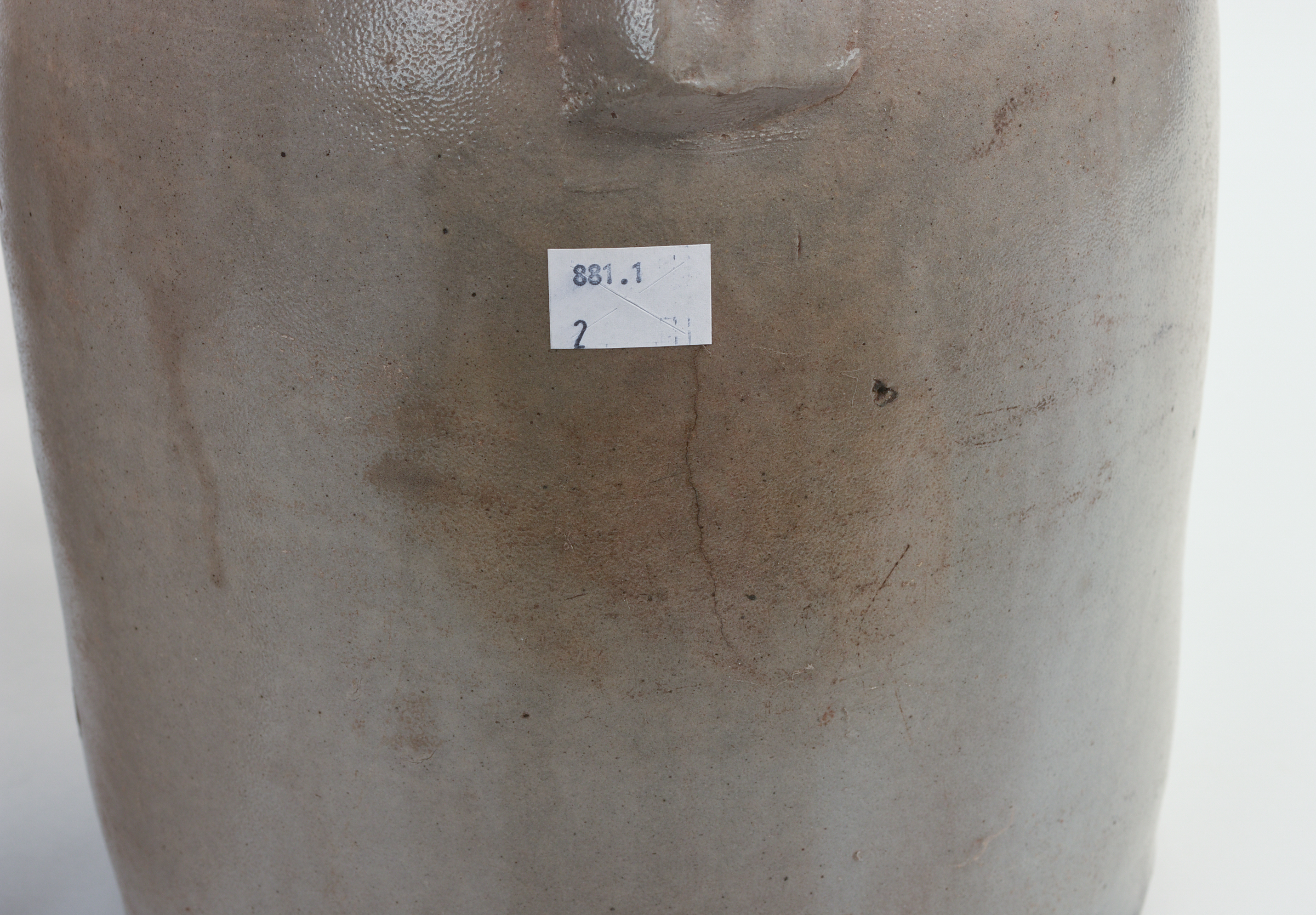 TWO TWO-GALLON STONEWARE JUGS.