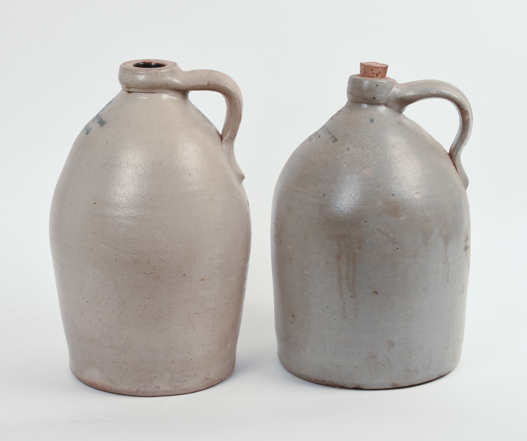 TWO TWO-GALLON STONEWARE JUGS.