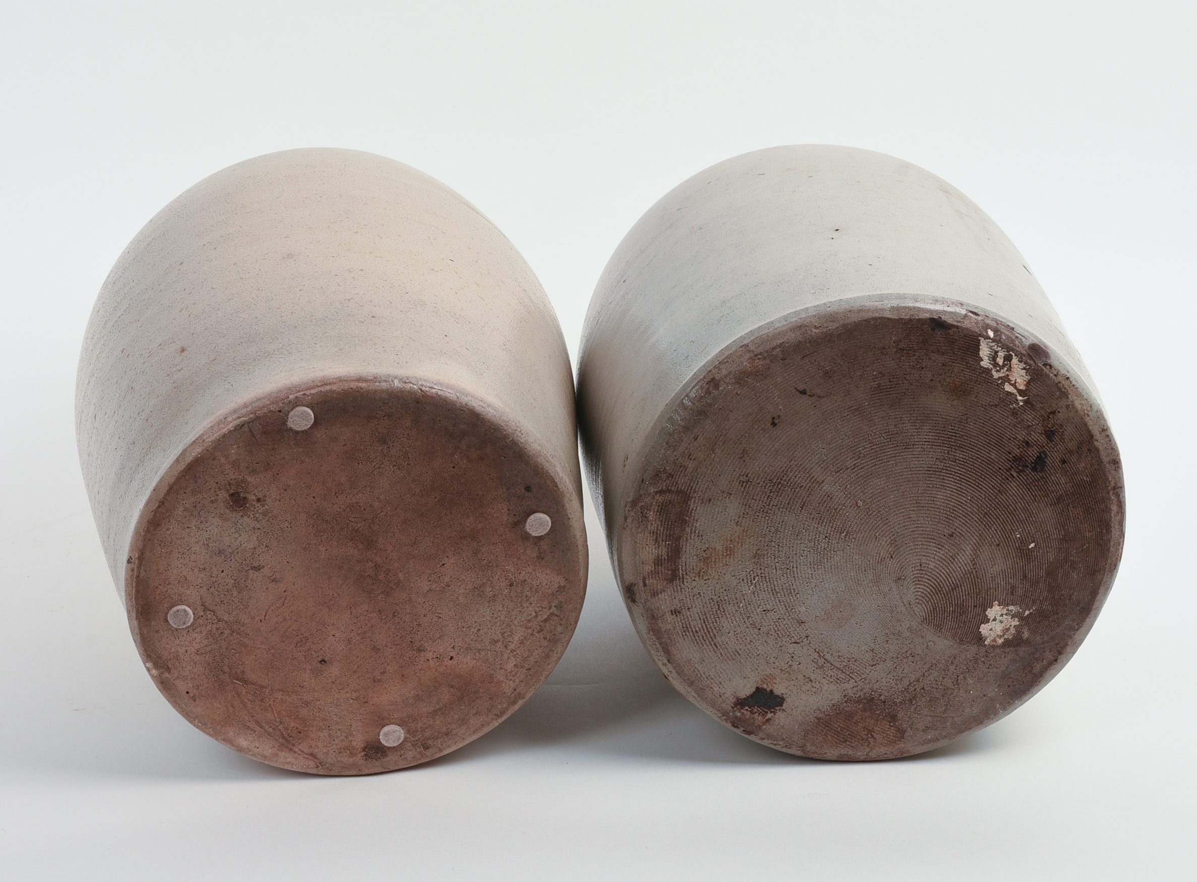 TWO TWO-GALLON STONEWARE JUGS.