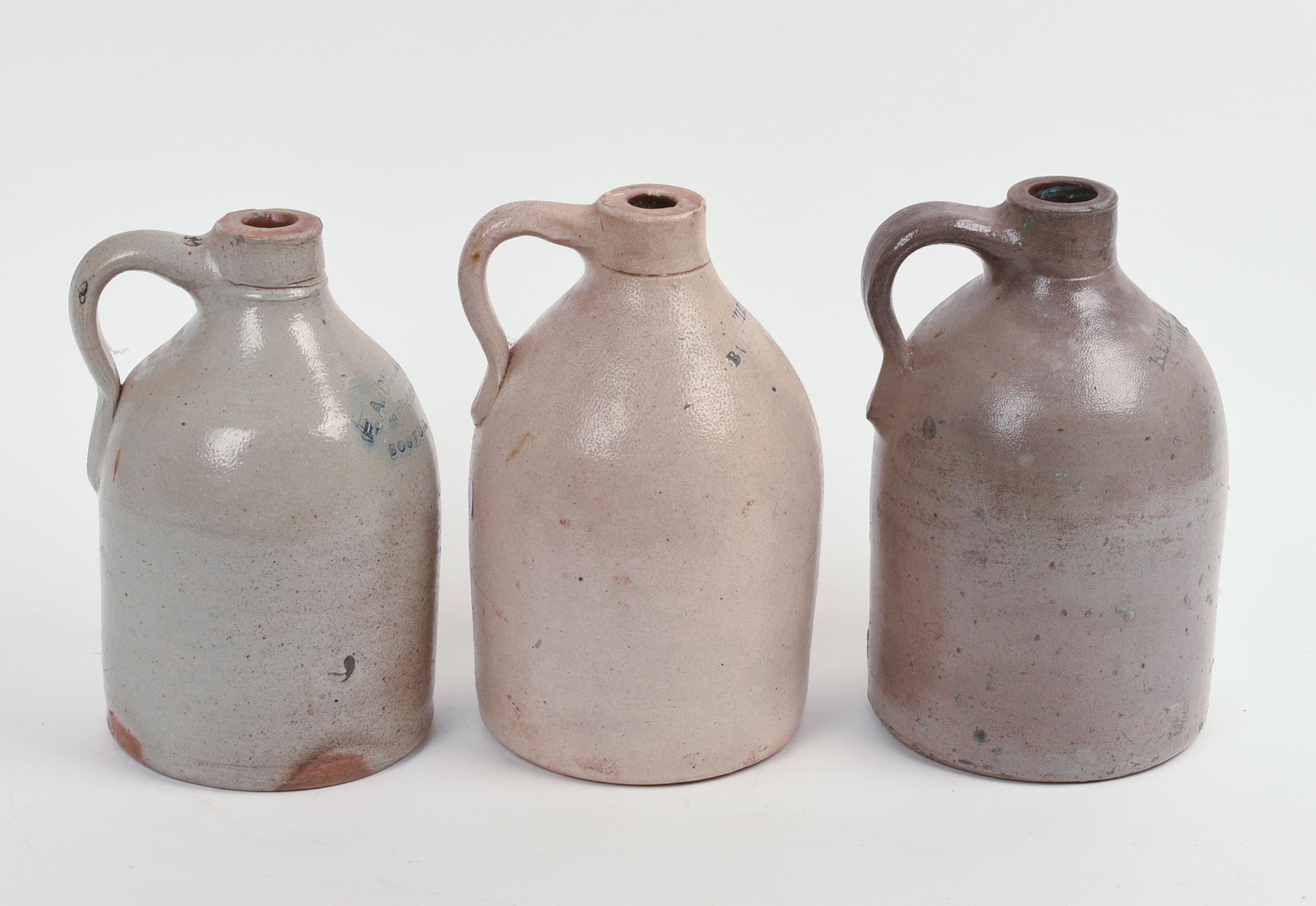 THREE SMALL STONEWARE JUGS.