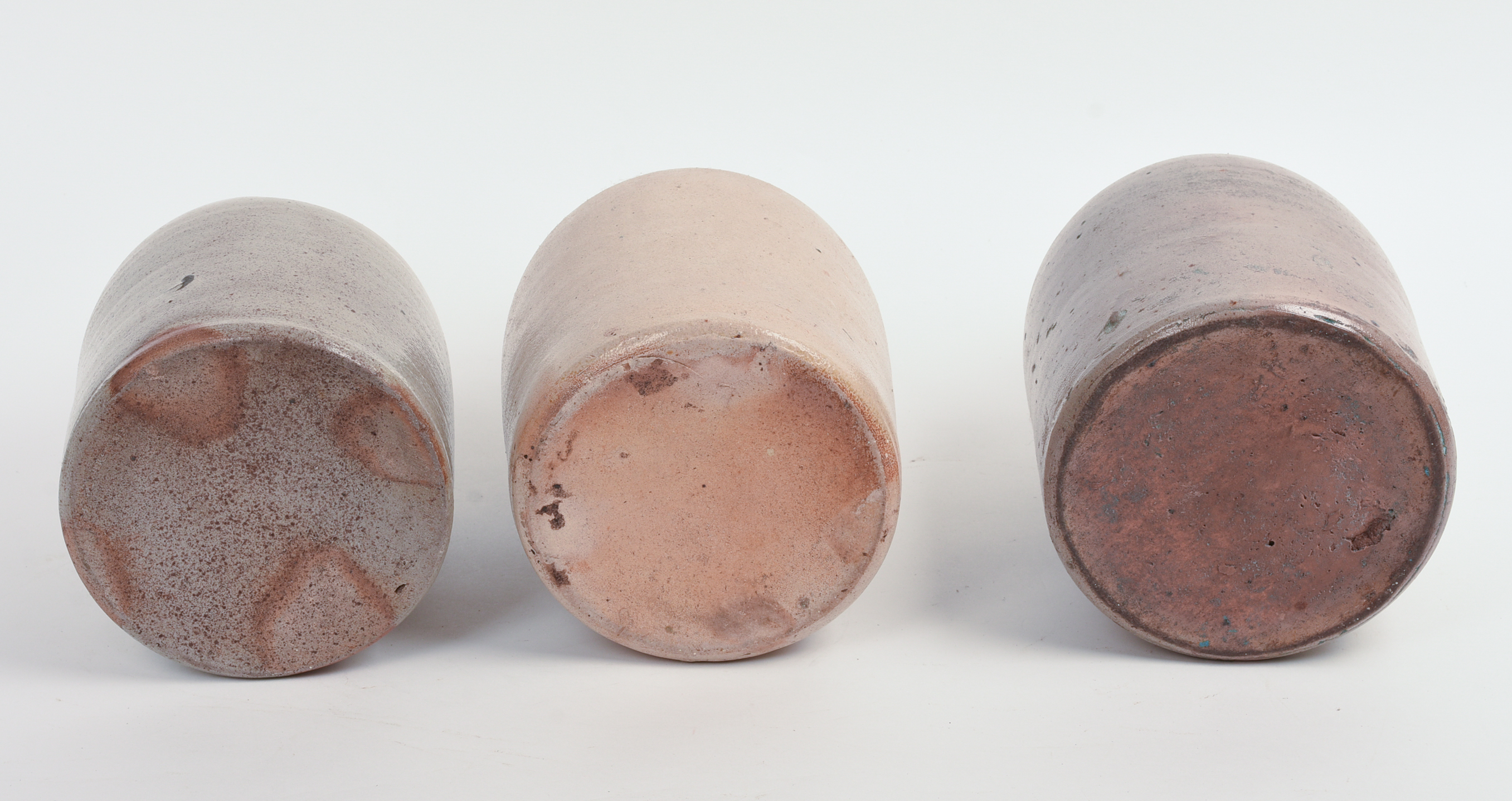 THREE SMALL STONEWARE JUGS.