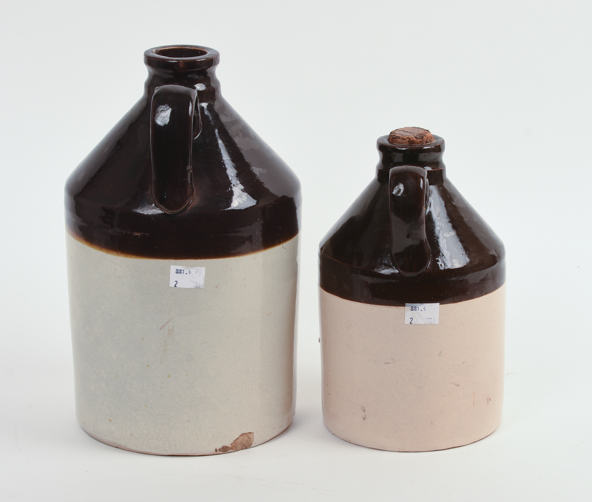 TWO E. SWASEY & CO. STONEWARE CROCKS.