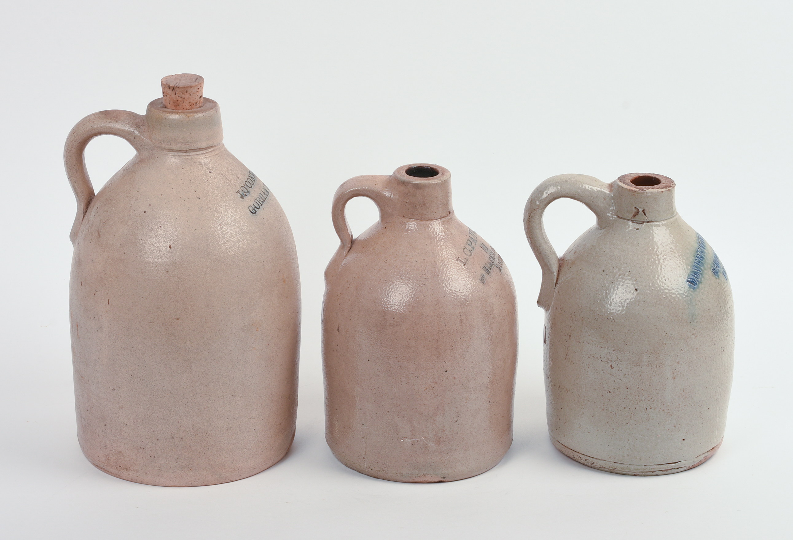THREE STONEWARE JUGS.
