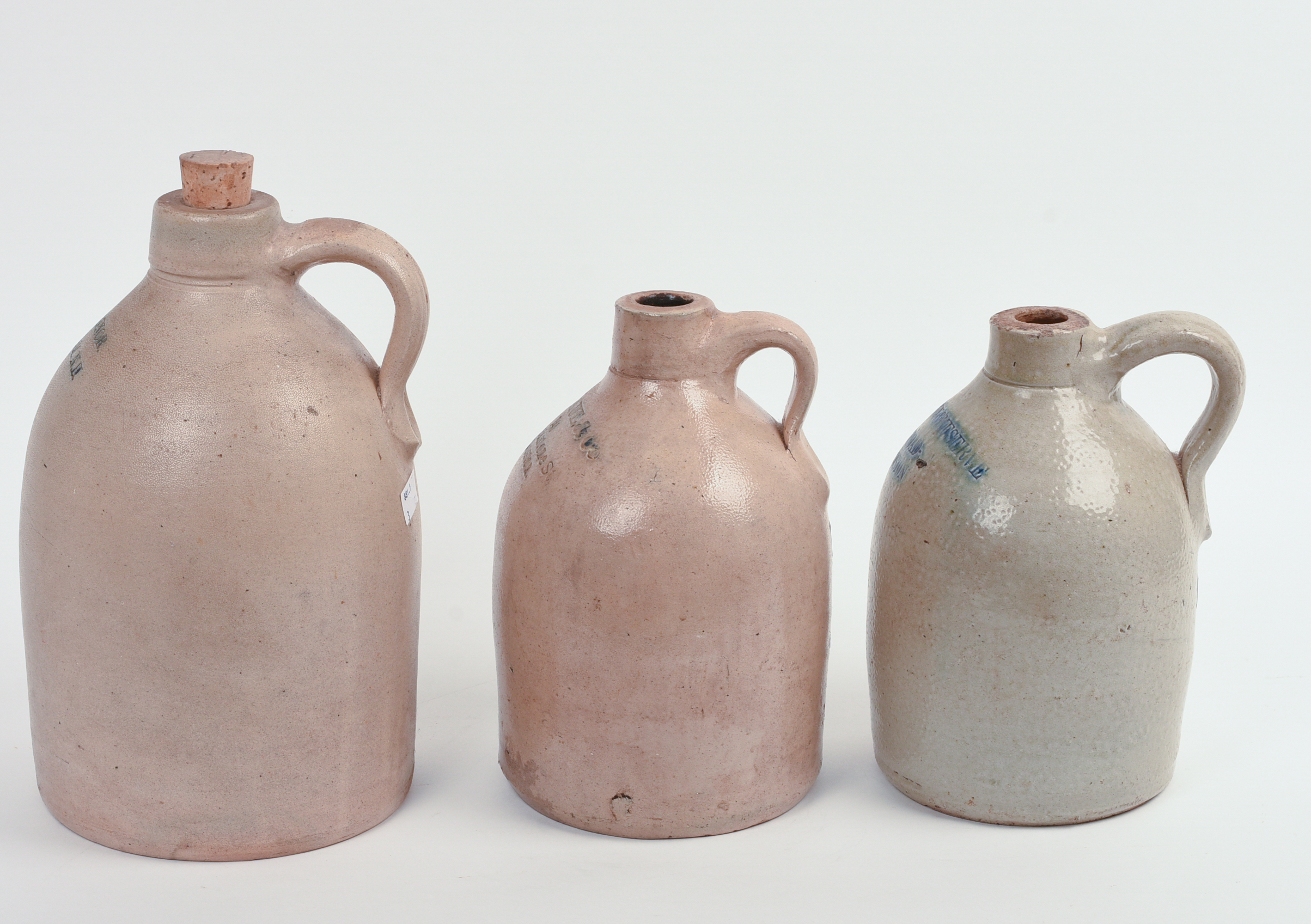 THREE STONEWARE JUGS.
