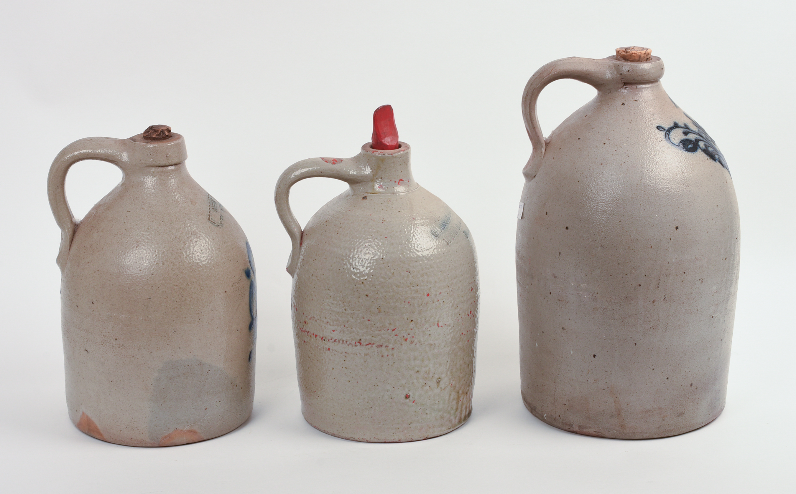 THREE STONEWARE JUGS.
