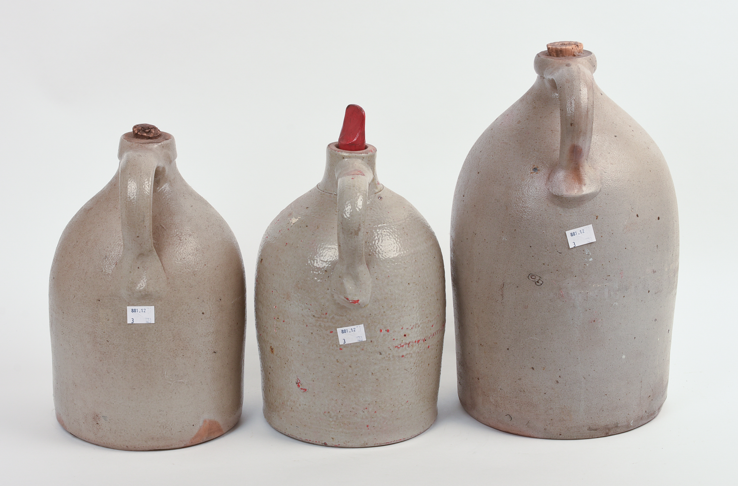 THREE STONEWARE JUGS.