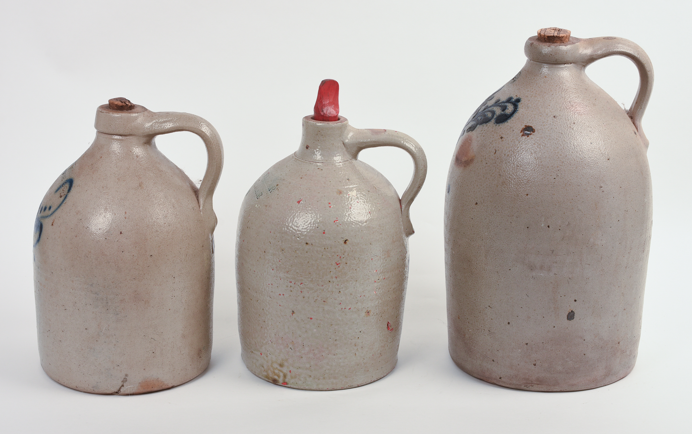 THREE STONEWARE JUGS.