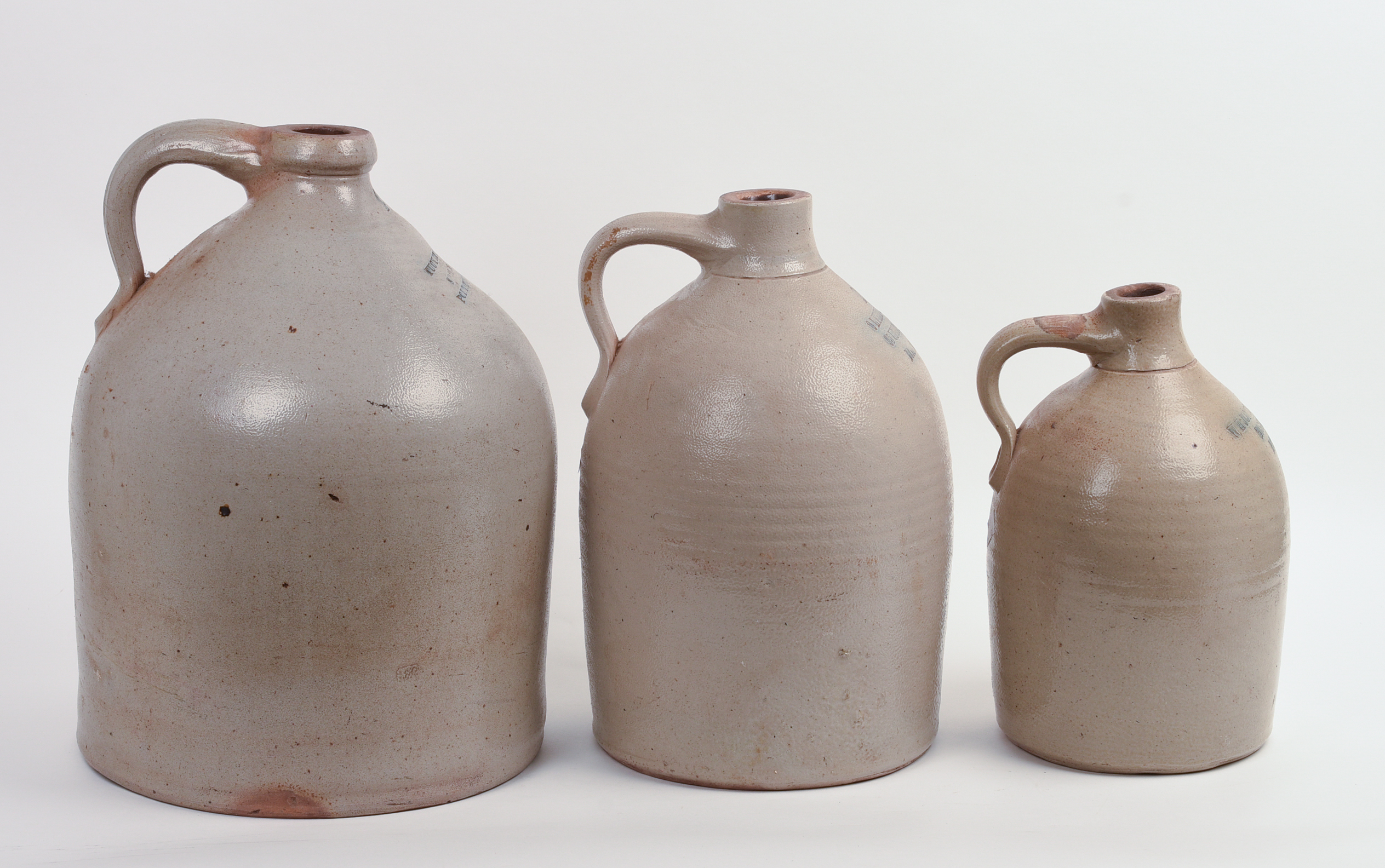 THREE STONEWARE JUGS.