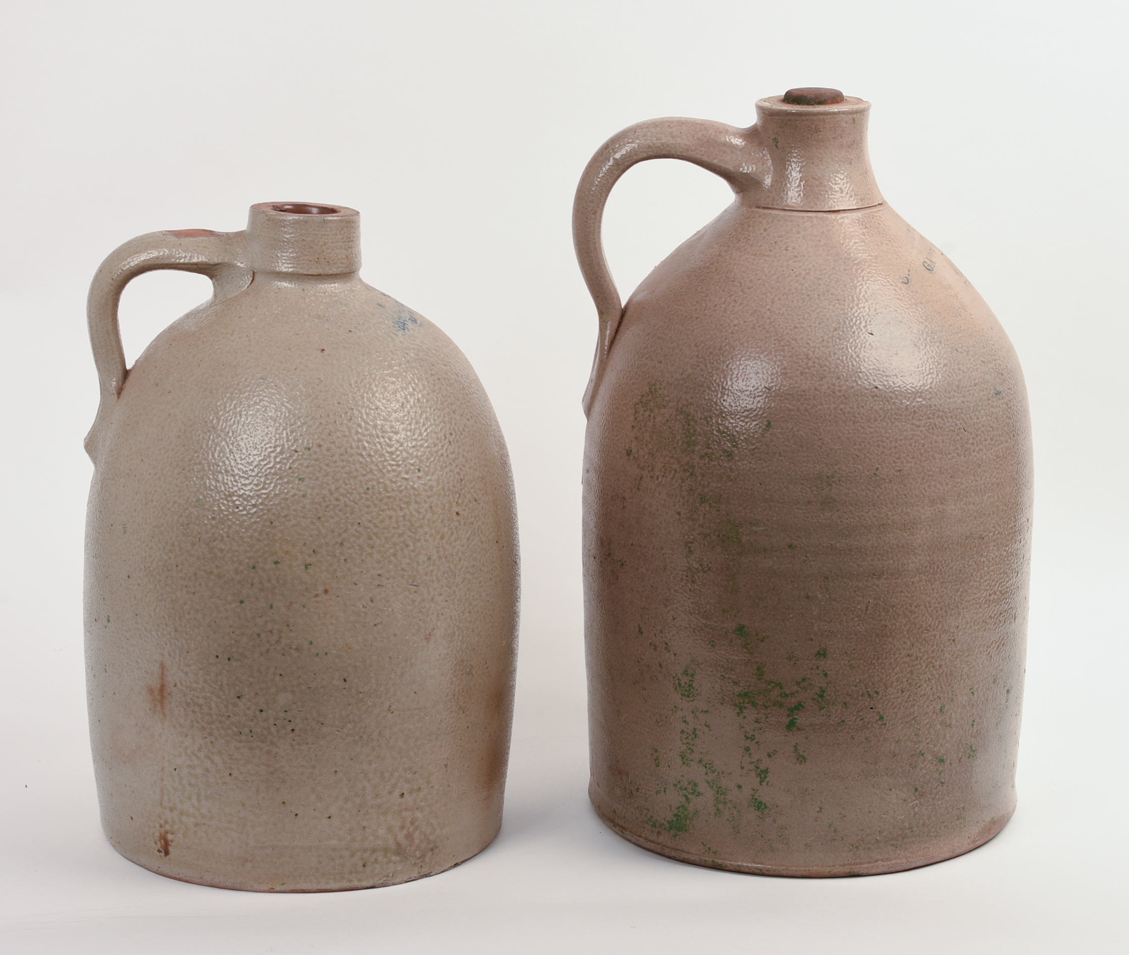 TWO LARGE STONEWARE JUGS.