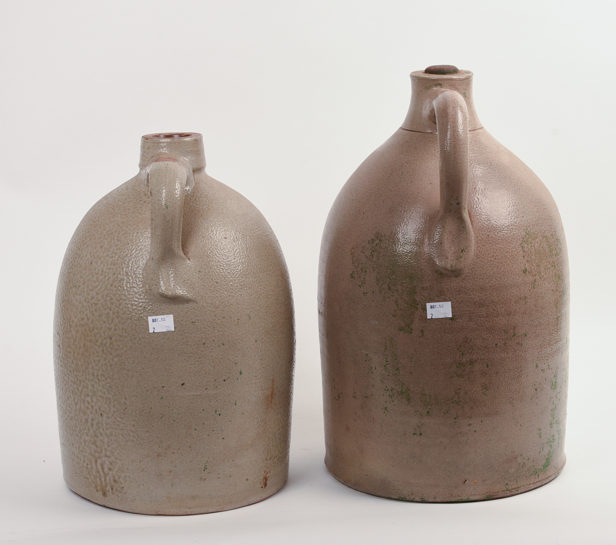 TWO LARGE STONEWARE JUGS.