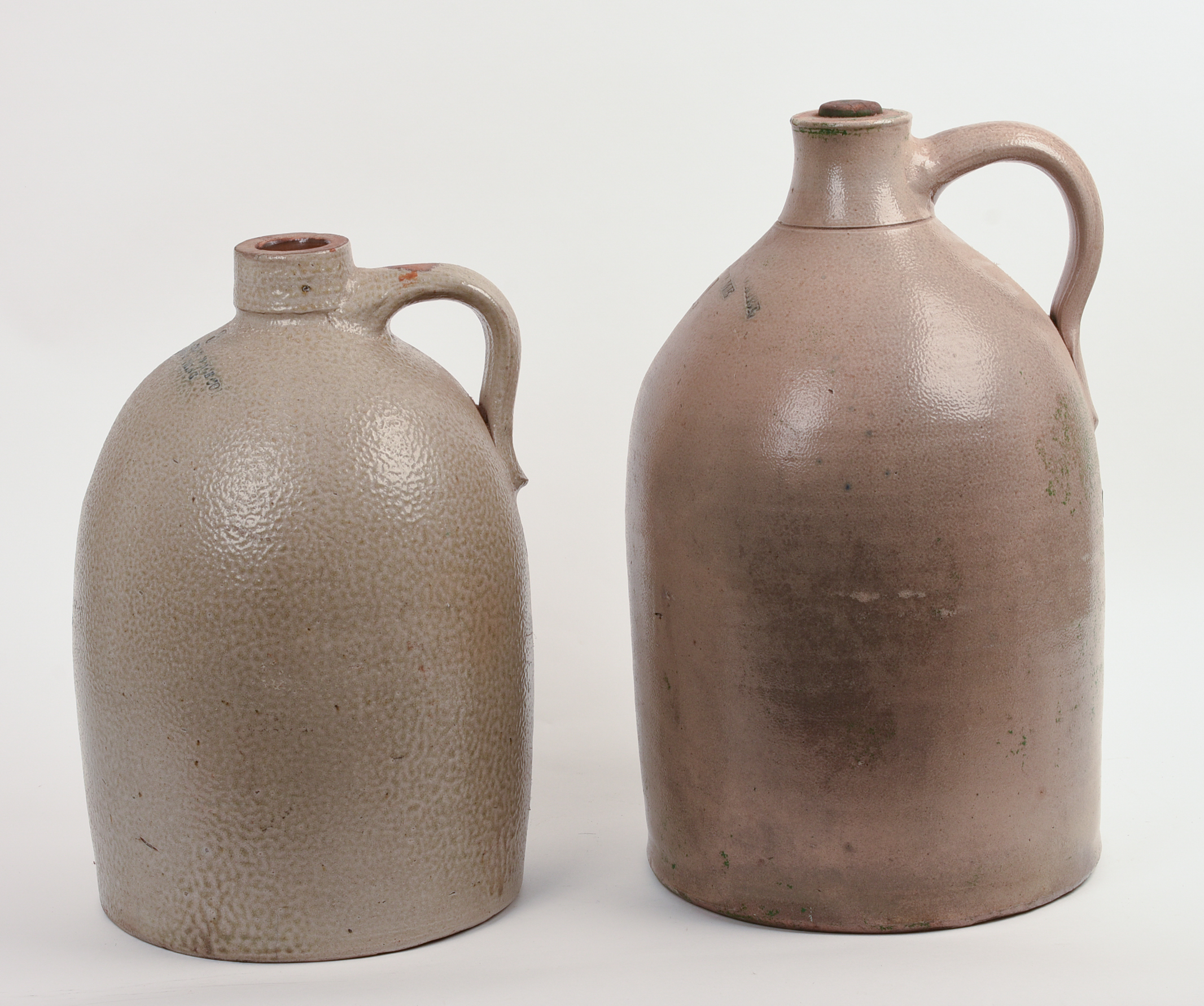 TWO LARGE STONEWARE JUGS.