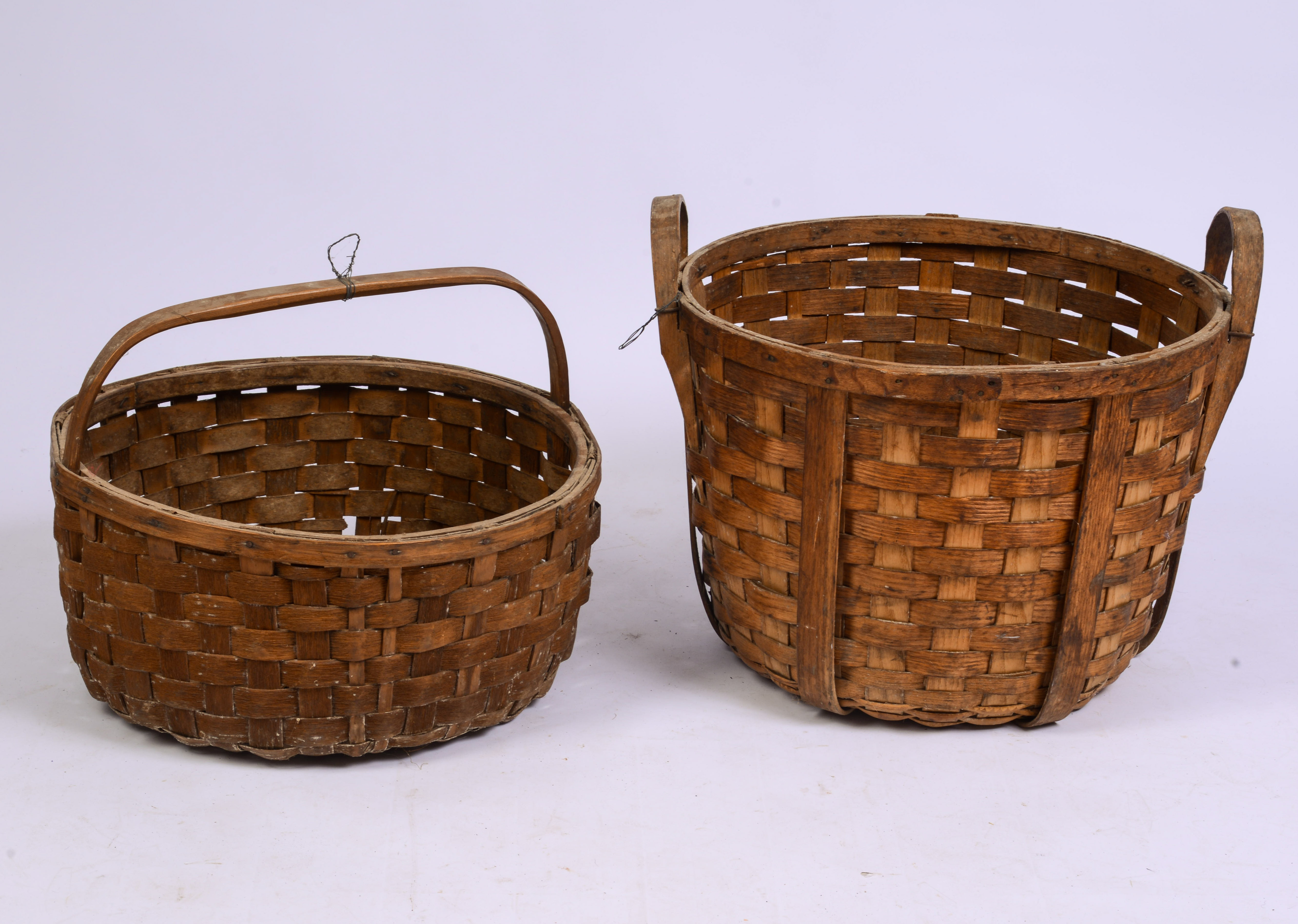 TWO LARGE ANTIQUE BASKETS.