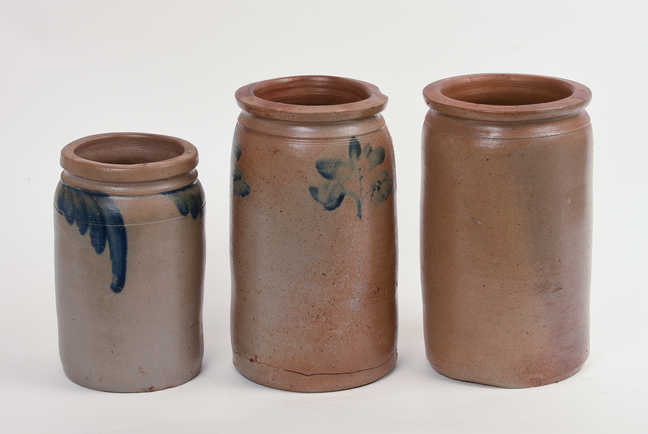THREE STONEWARE CROCKS.