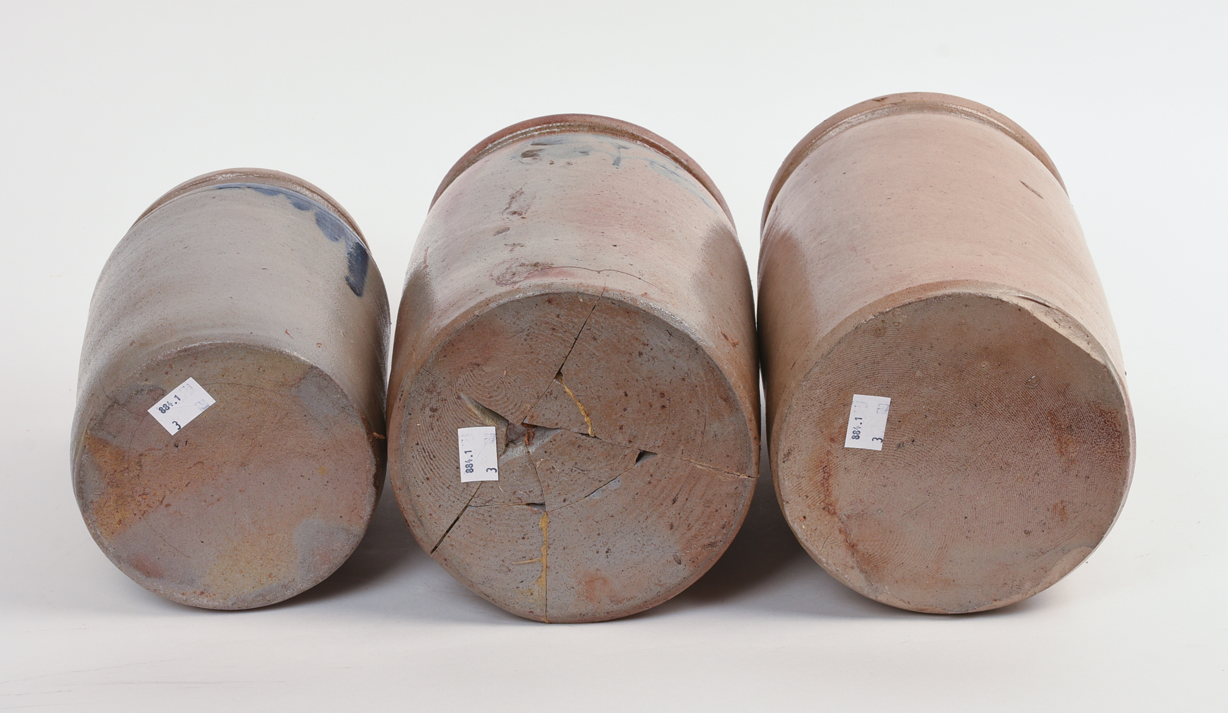 THREE STONEWARE CROCKS.
