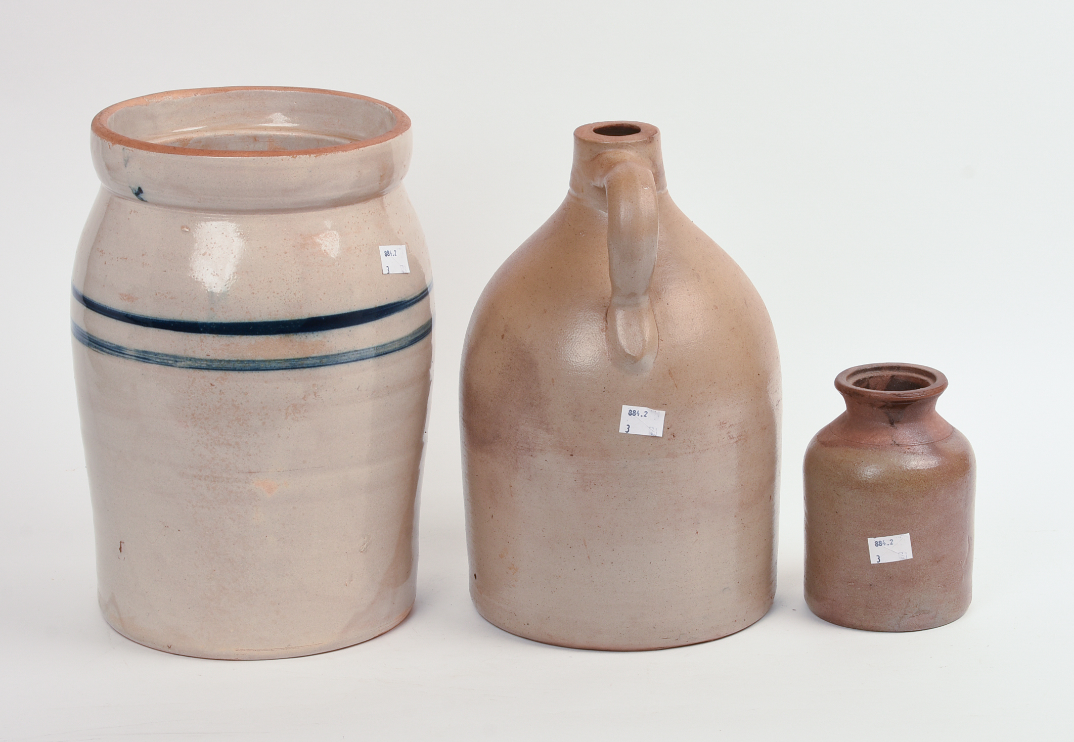 THREE STONEWARE PIECES.