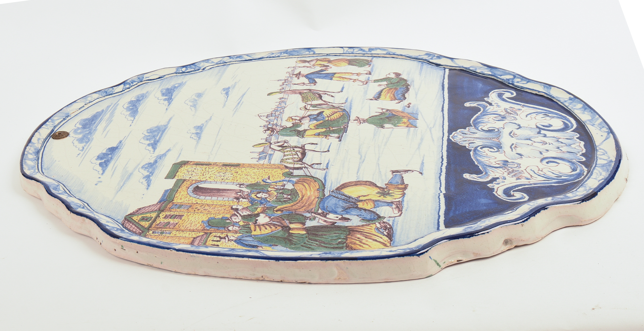 LARGE DELFT PLAQUE WITH SKATING SCENE.