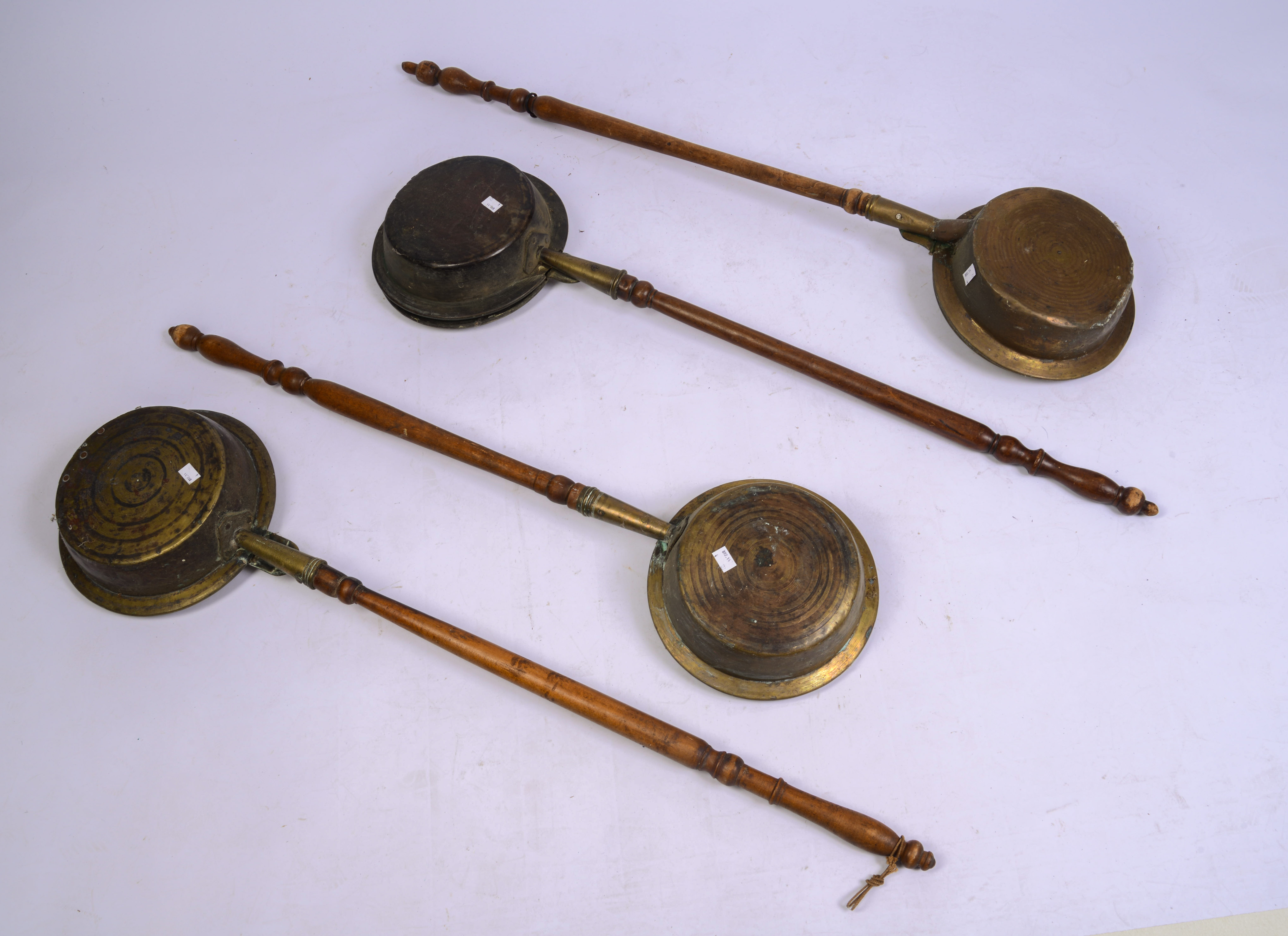 LOT OF FOUR 18TH CENT. BRASS BED WARMERS.