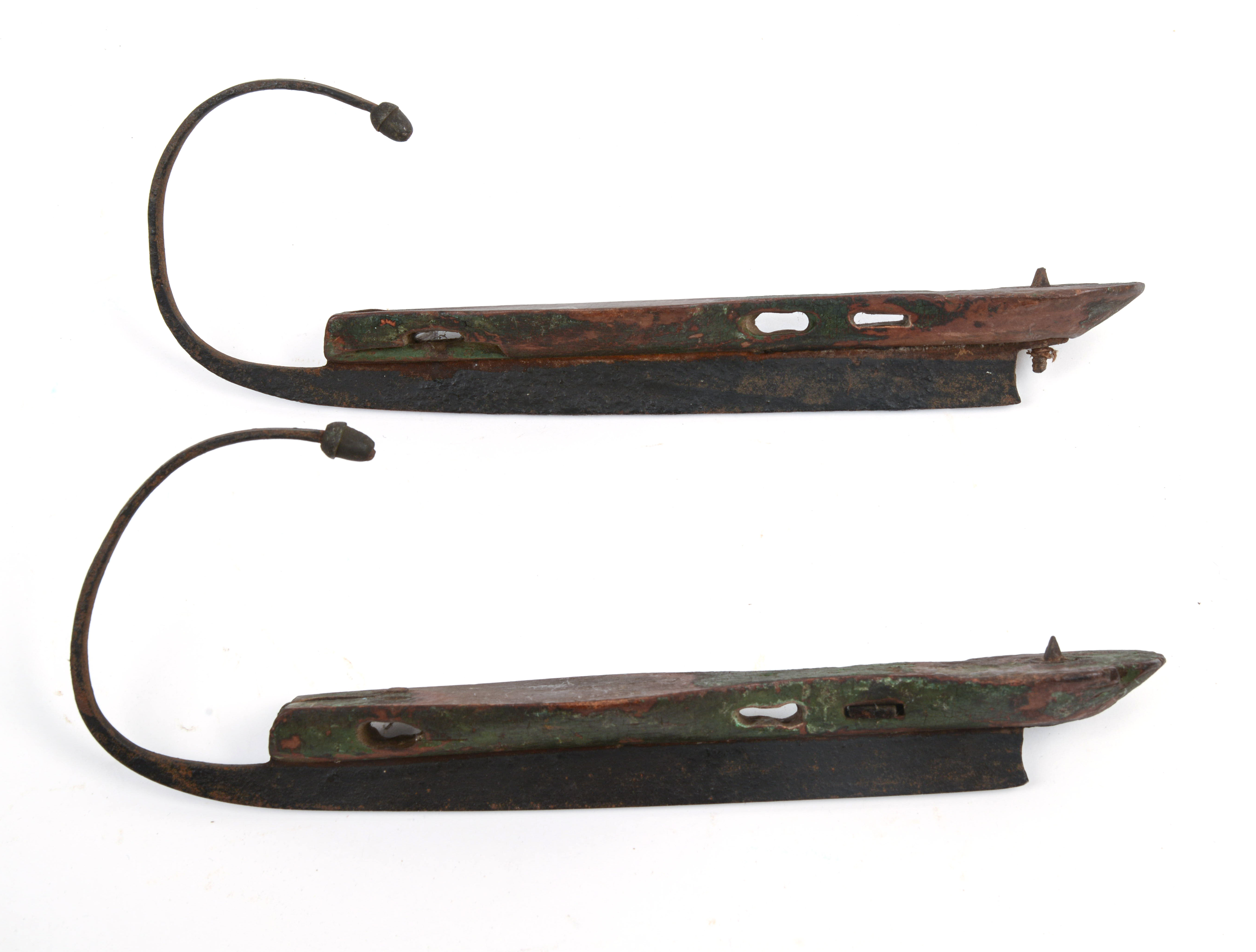 19TH CENTURY STEEL-AND-WOOD ICE SKATES.