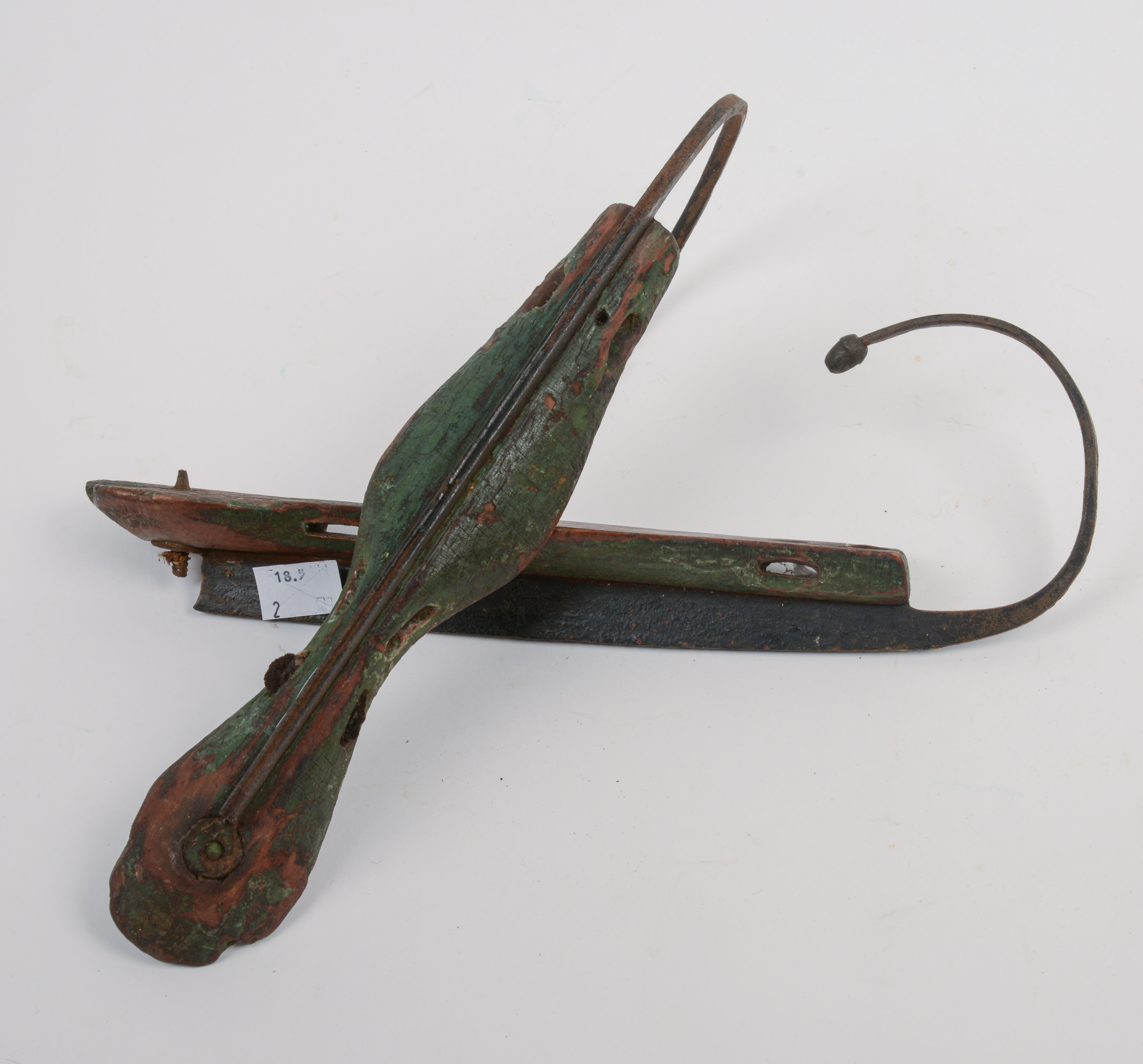19TH CENTURY STEEL-AND-WOOD ICE SKATES.