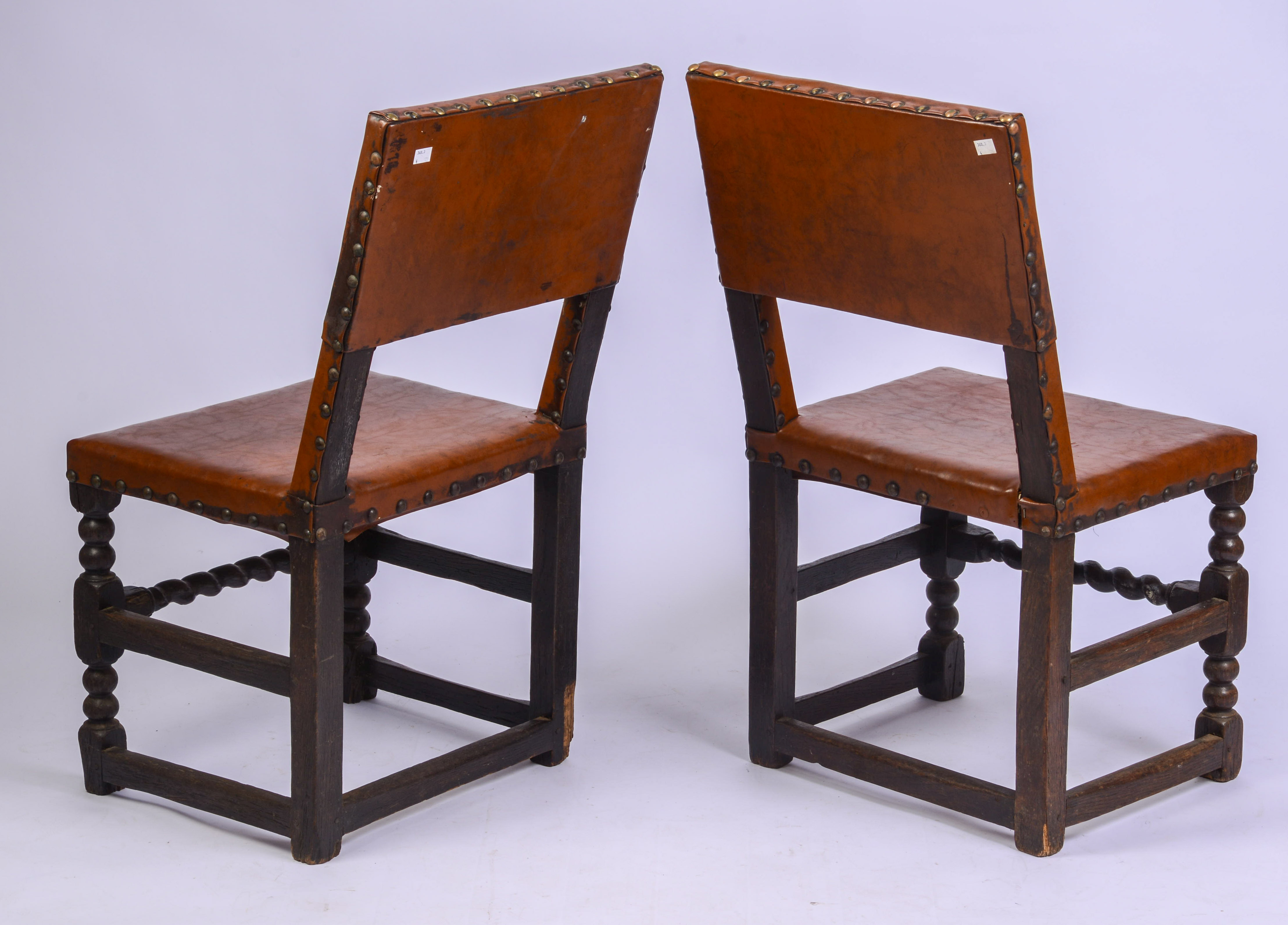 SCARCE SET OF FOUR, MID-17TH CENTURY LEATHER BACK STOOLS.