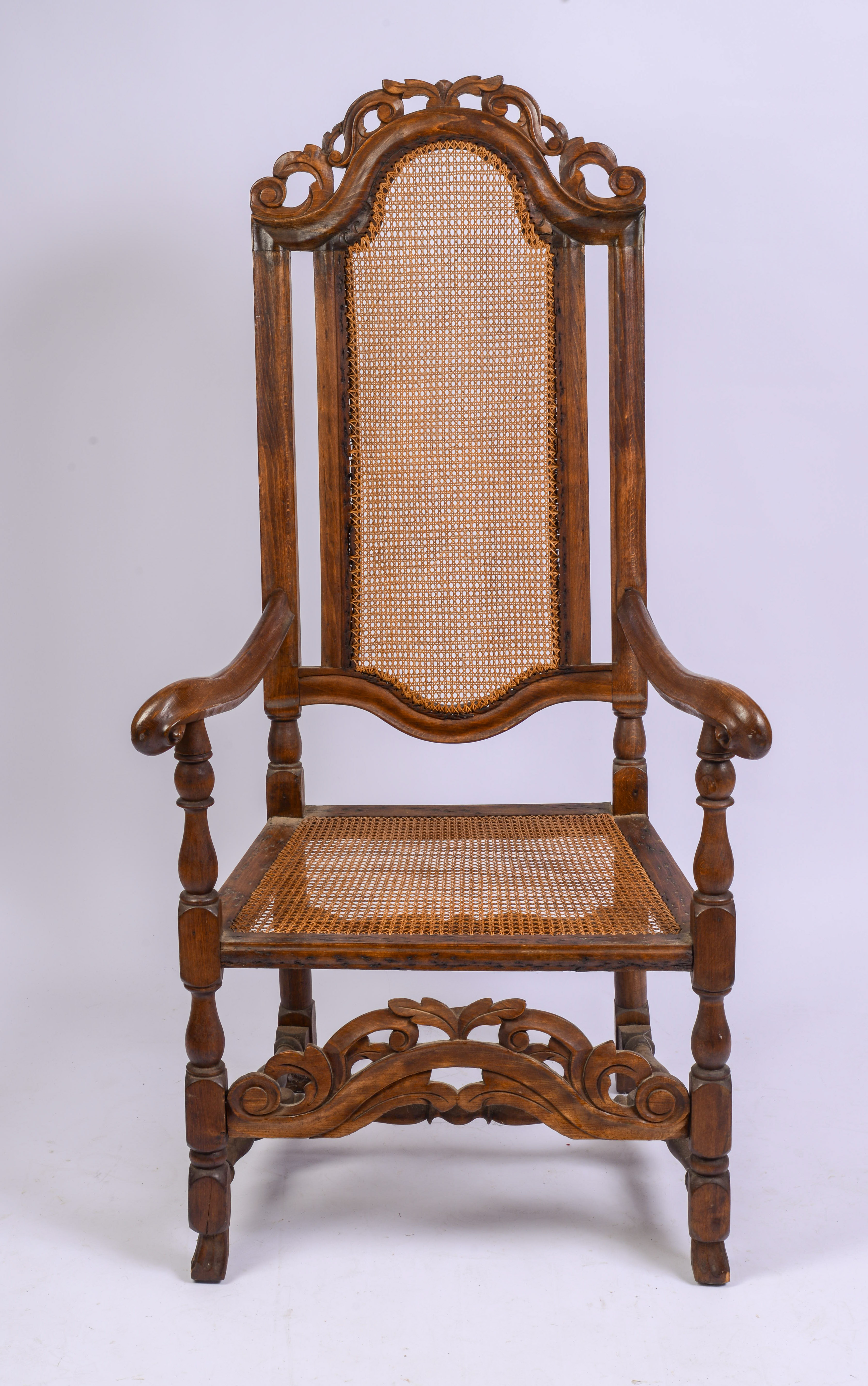 JACOBEAN CANE BACK ARMCHAIR.