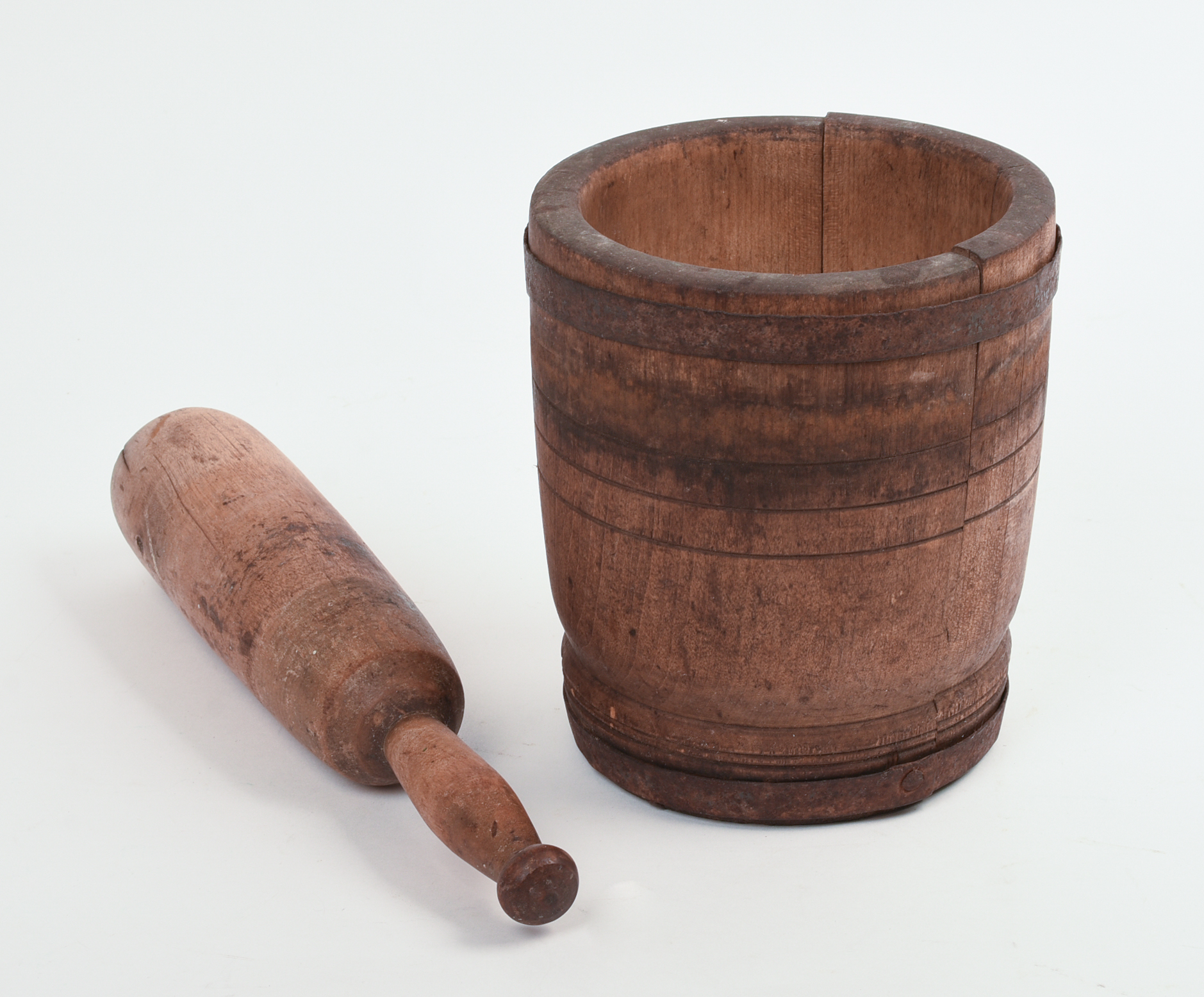 IRON BOUND MORTAR AND PESTLE.