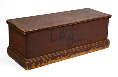 PINE BLANKET CHEST IN OLD RED WITH BOSTON ADDRESS. Height 15.5 inches, length 43.5 inches 