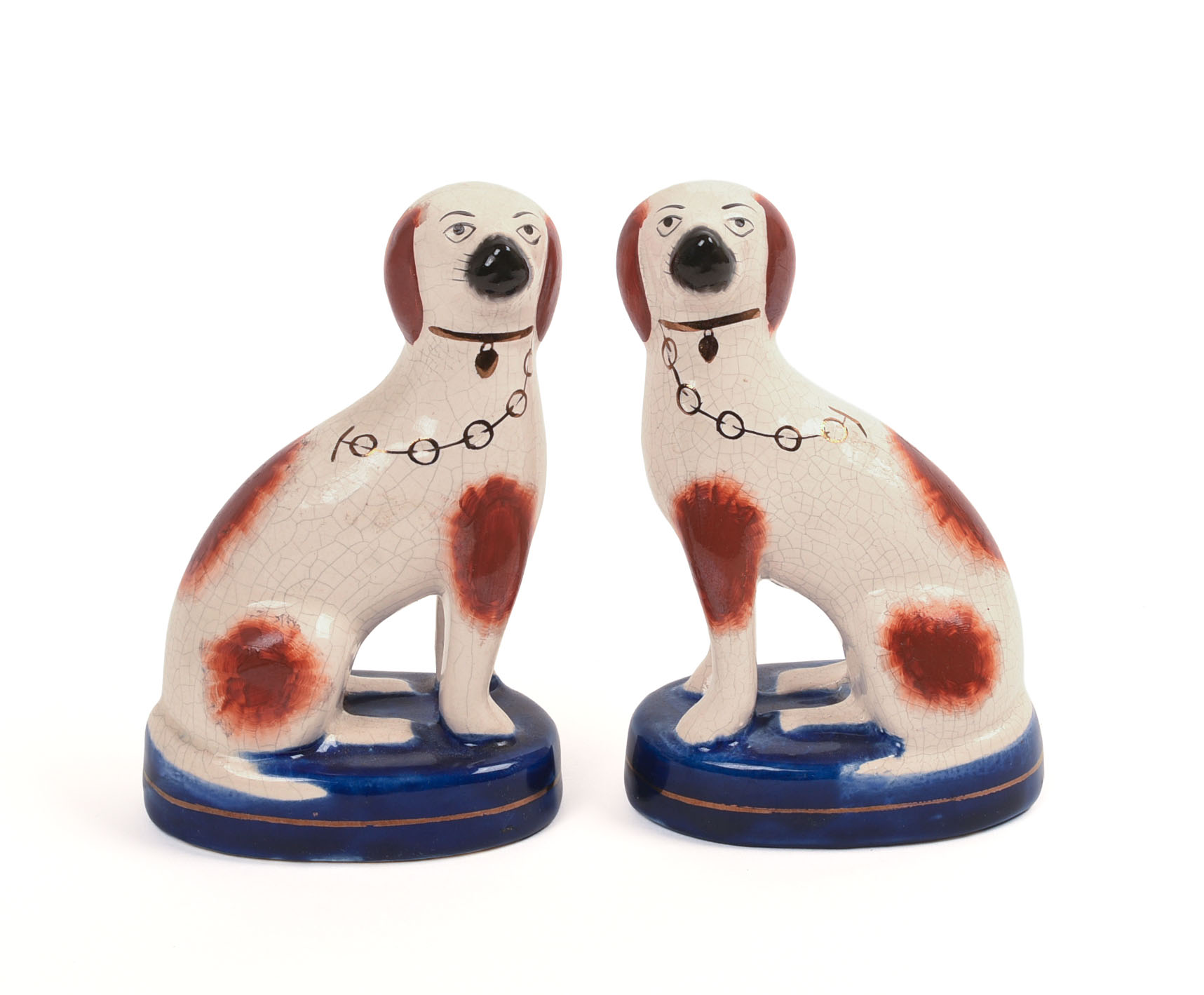 PAIR OF STAFFORDSHIRE POTTERY DOGS