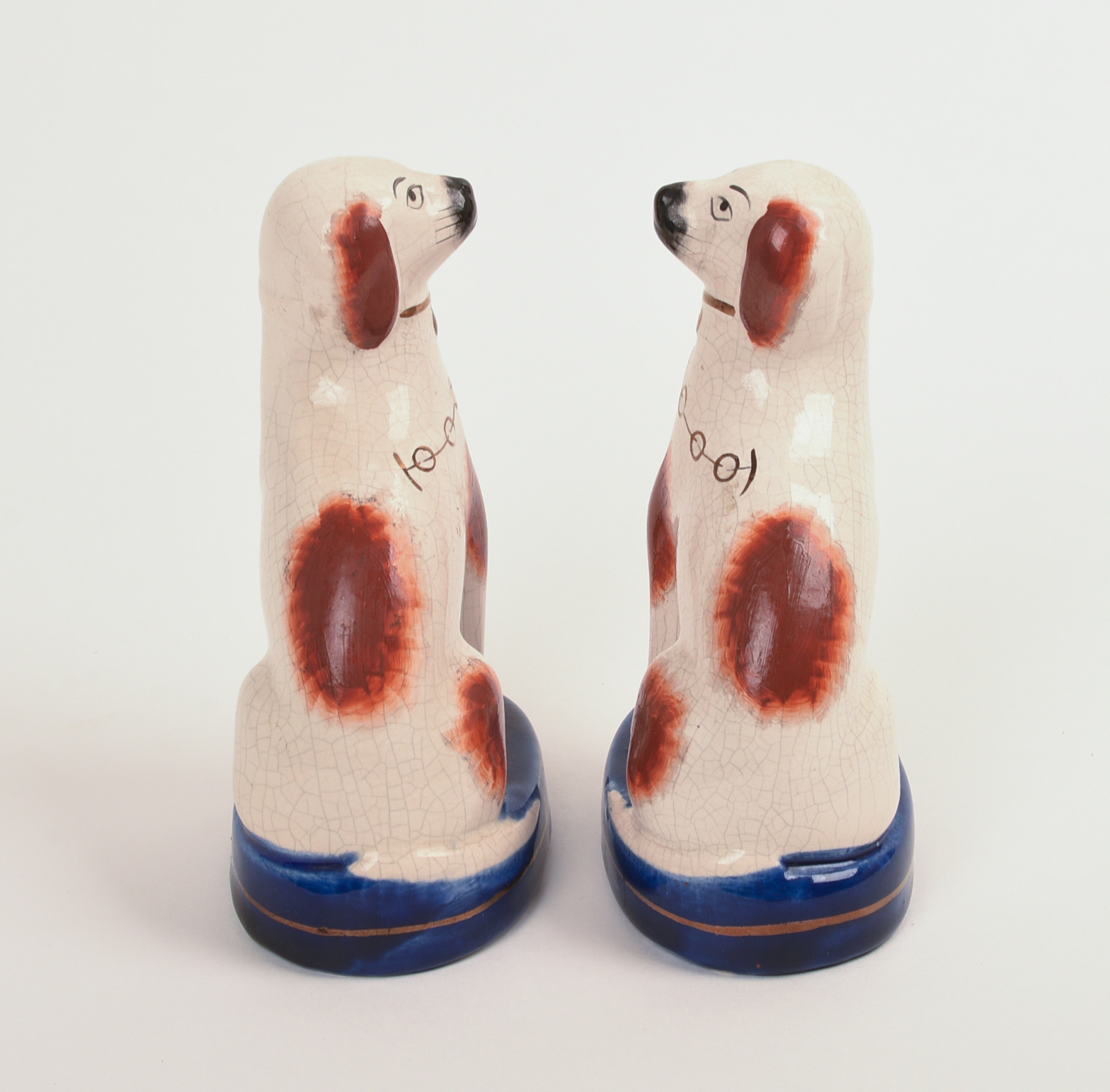 PAIR OF STAFFORDSHIRE POTTERY DOGS