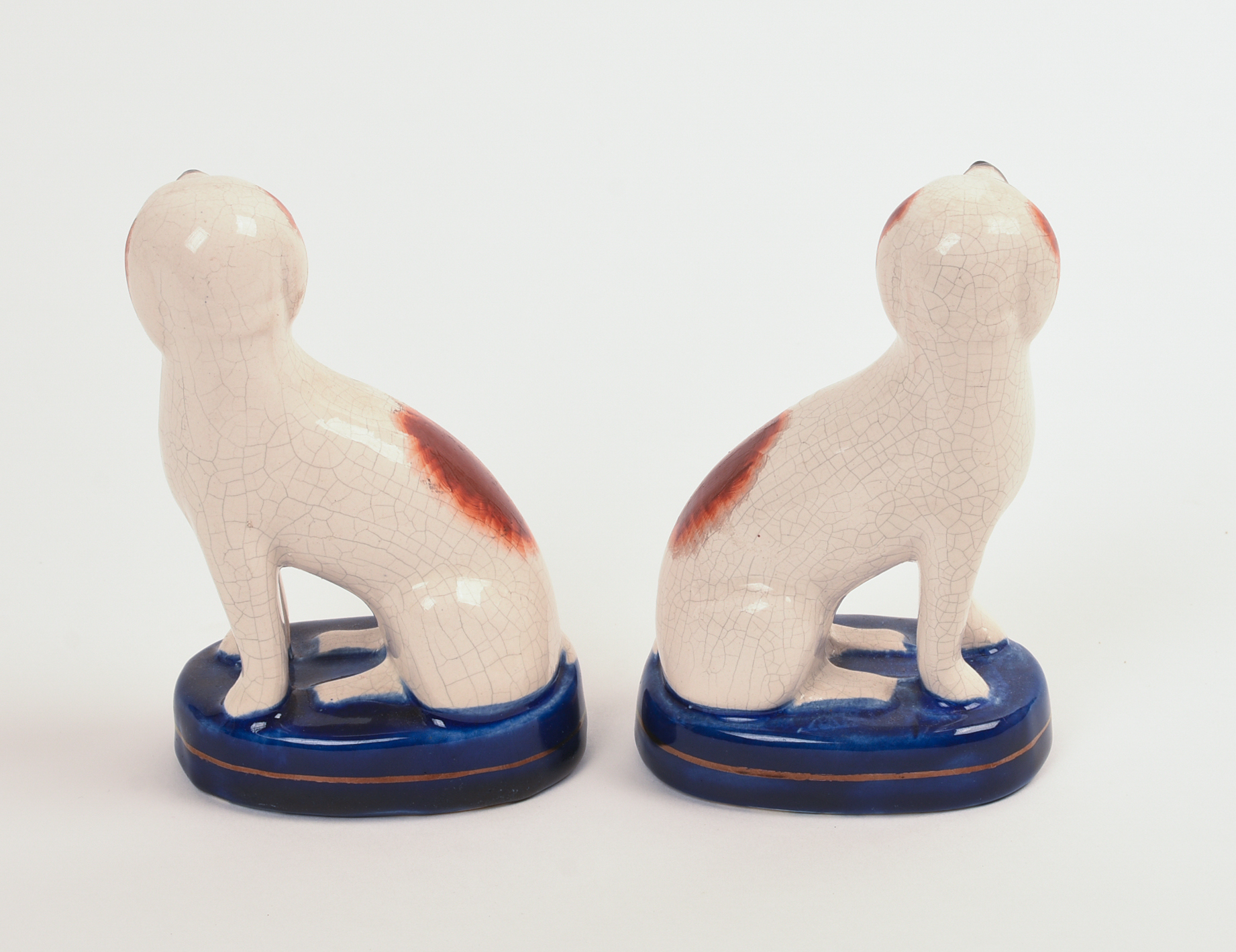 PAIR OF STAFFORDSHIRE POTTERY DOGS