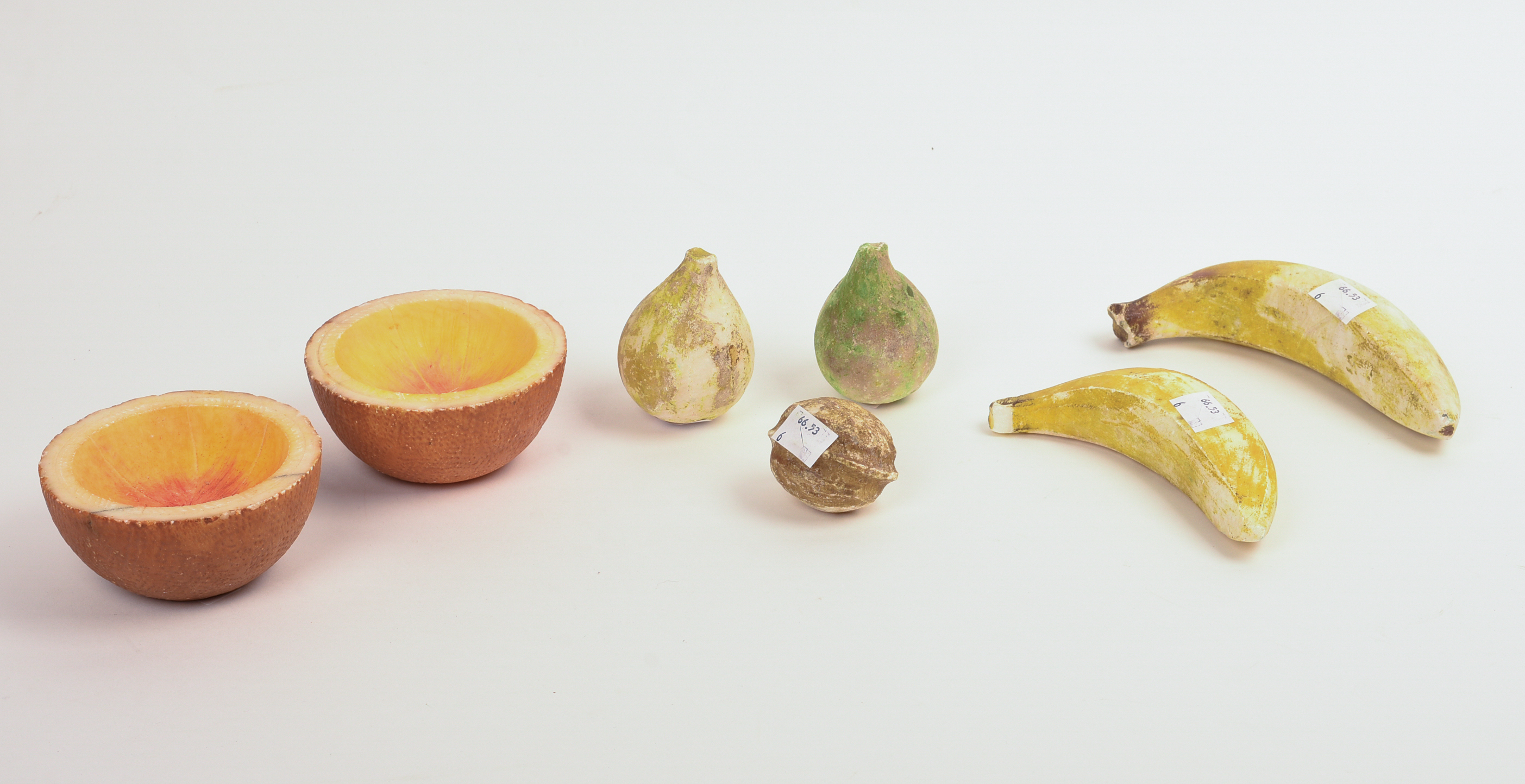 SIX PIECES OF STONE FRUIT