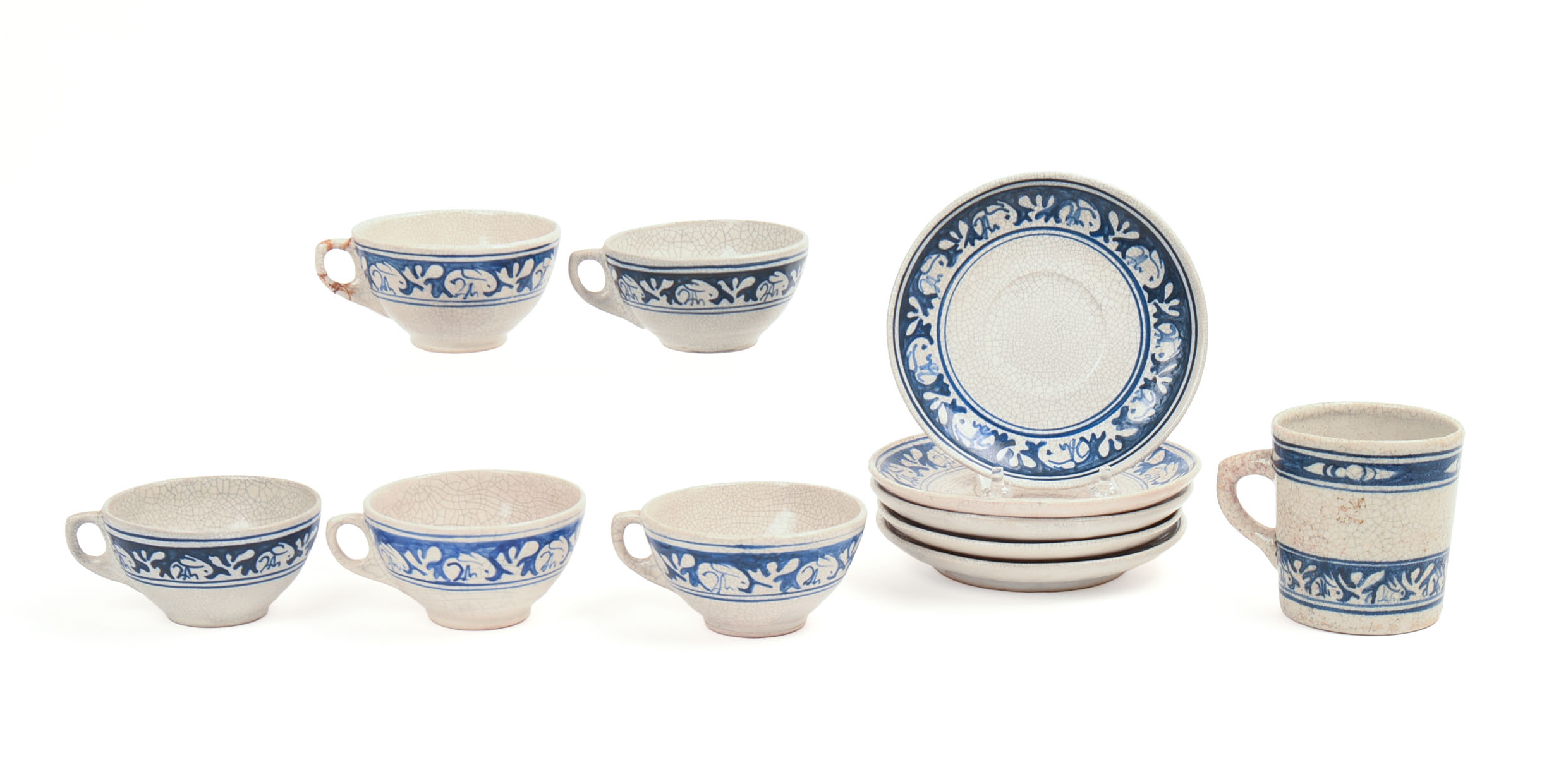 FIVE DEDHAM POTTERY RABBIT PATTERN TEACUPS AND SAUCERS AND A MUG